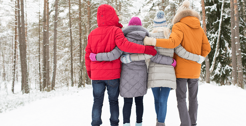 Photo of a group of people walking in the snow.