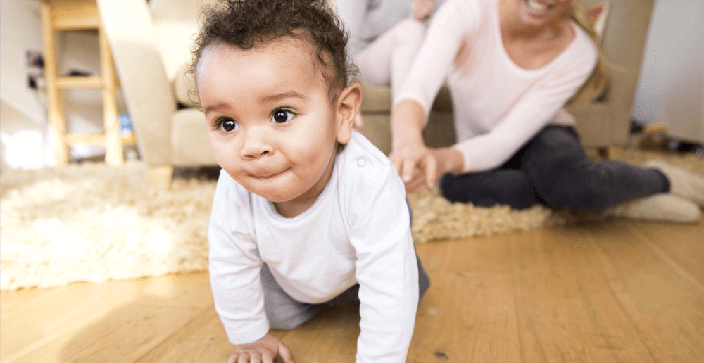 Photo of an infant crawling